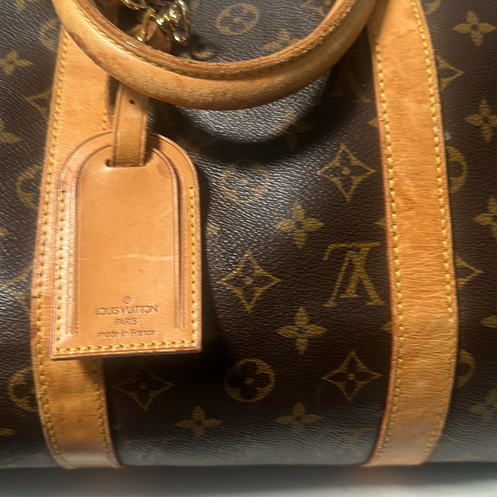 Louis Vuitton traveling duffel bag